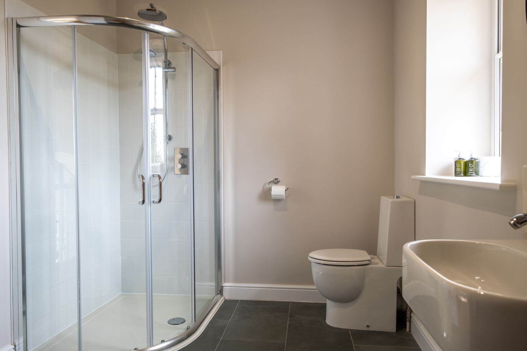 A separate shower enclosure, basin and WC