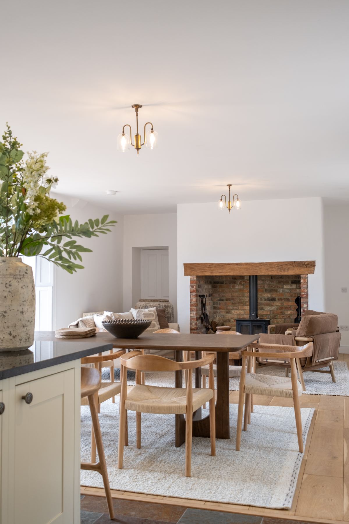 The dining table and the woodburner in its brick inglenook