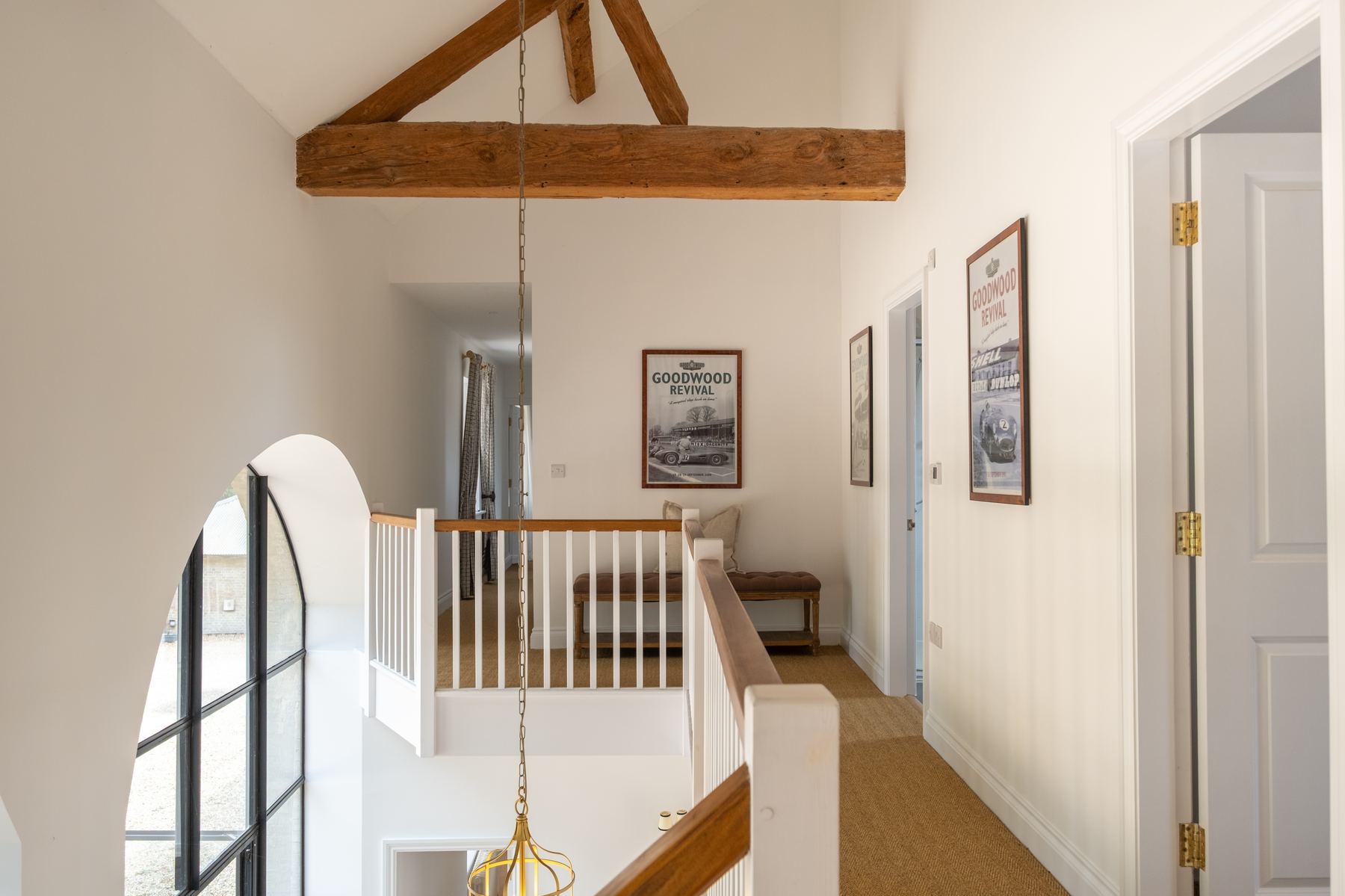 The upstairs landing, under exposed roof timbers