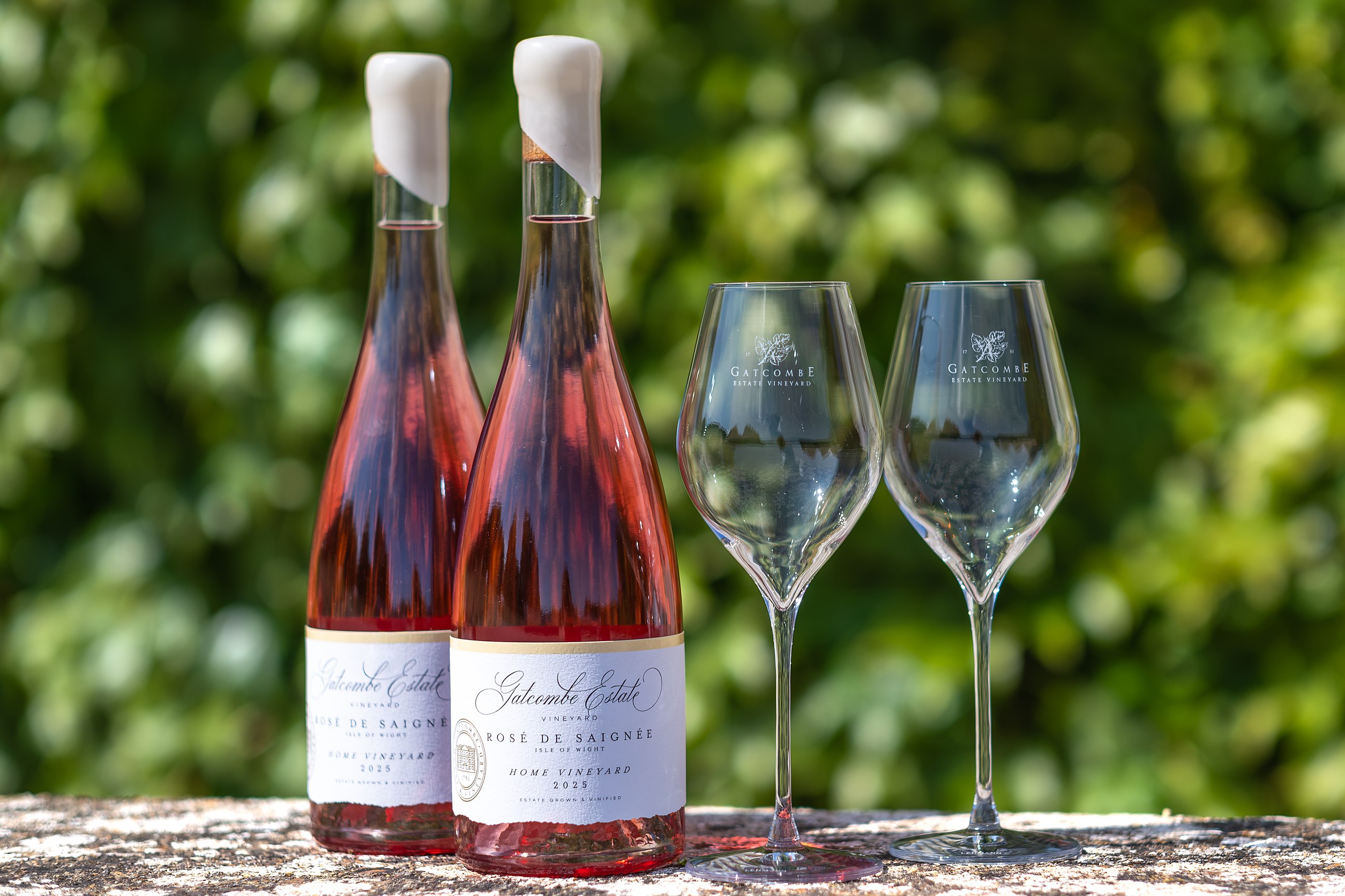 Two bottles of the estate rosé and two glasses in the sunshine